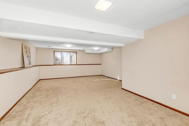 below grade area with carpet flooring and baseboards