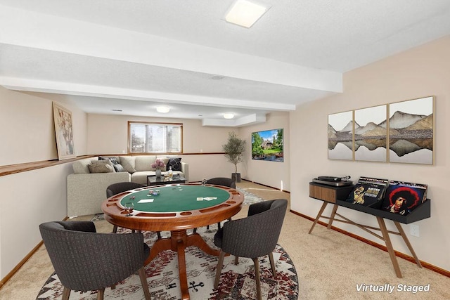 rec room featuring baseboards, an AC wall unit, beam ceiling, and light colored carpet