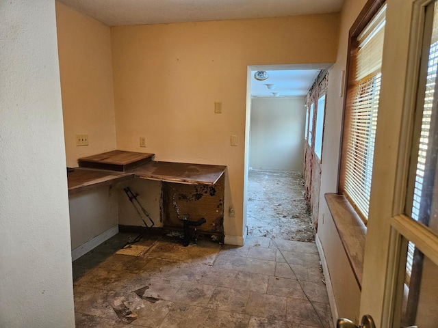21888 650th Ave, Dexter, MN 55926 - unfurnished office featuring baseboards and stone finish flooring