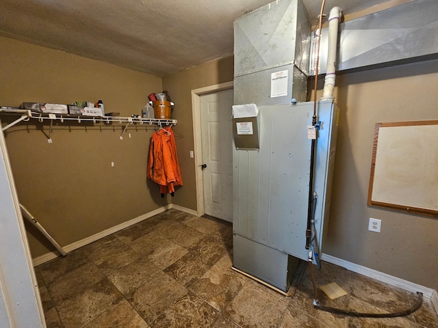 21888 650th Ave, Dexter, MN 55926 - utility room featuring heating unit