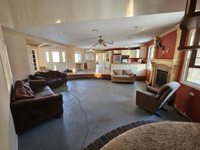 21888 650th Ave, Dexter, MN 55926 - living room featuring finished concrete flooring, ceiling fan, plenty of natural light, a fireplace, and recessed lighting