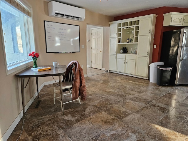 21888 650th Ave, Dexter, MN 55926 - dining space featuring a wall mounted AC and stone finish floors