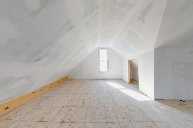 additional living space with lofted ceiling