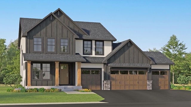 view of front of property featuring roof with shingles, board and batten siding, a front yard, a garage, and driveway