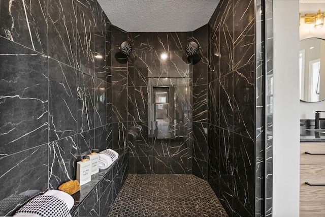 full bath with a textured ceiling and a marble finish shower