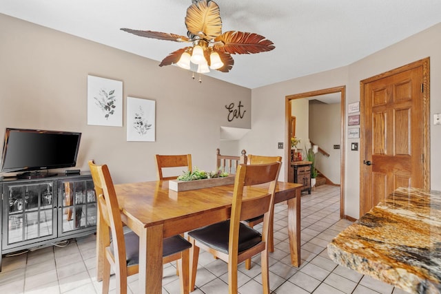 dining room with light tile patterned floors and a ceiling fan
