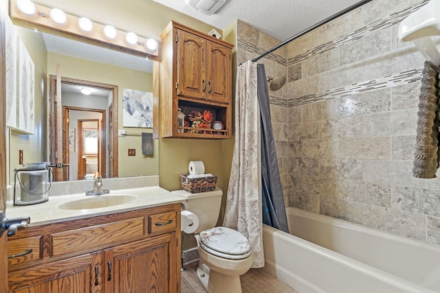 full bath featuring shower / bath combo with shower curtain, vanity, toilet, a textured ceiling, and tile patterned floors