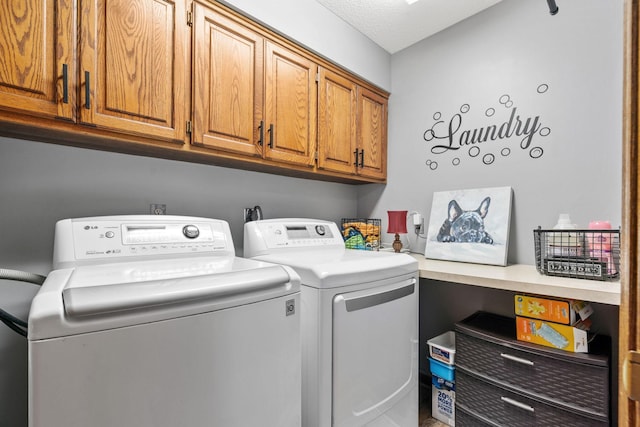 laundry area featuring cabinet space and independent washer and dryer