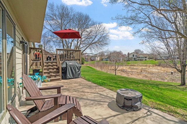 view of patio / terrace with a residential view, a wooden deck, stairs, and area for grilling