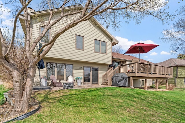 rear view of property with a yard, a patio area, a deck, and stairway