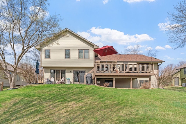 back of house with a lawn and a deck