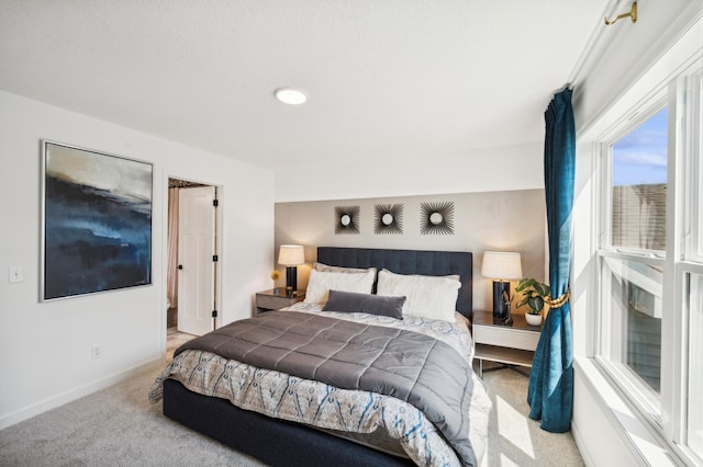 bedroom with carpet and baseboards