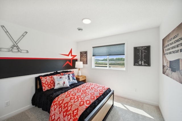 bedroom with carpet flooring and baseboards