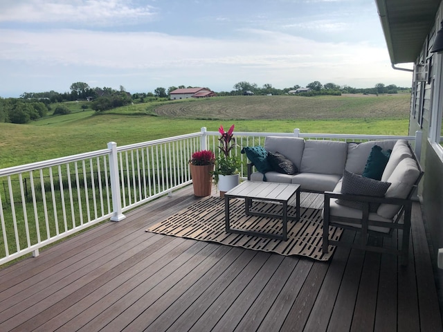 deck featuring an outdoor living space and a rural view