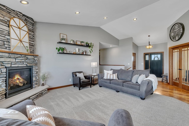 carpeted living room with recessed lighting, a fireplace, baseboards, and vaulted ceiling