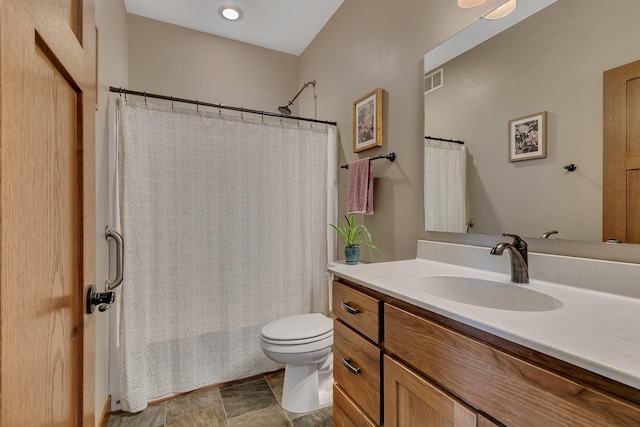 bathroom with visible vents, toilet, shower / tub combo with curtain, and vanity