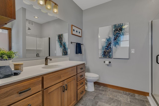 bathroom with visible vents, baseboards, vanity, and a shower stall