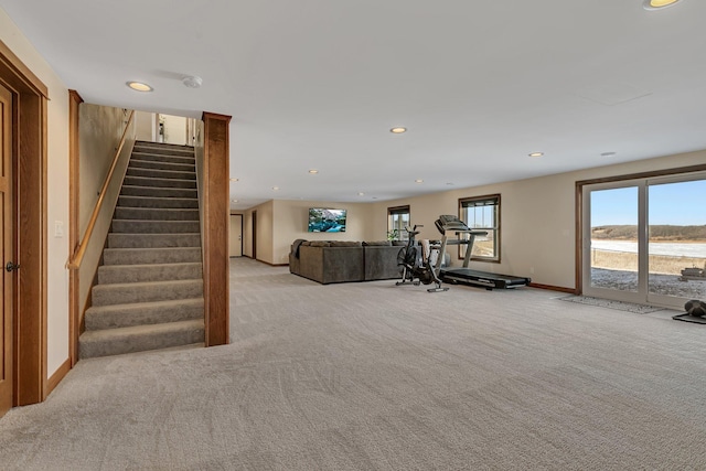 workout area featuring recessed lighting, baseboards, and light colored carpet