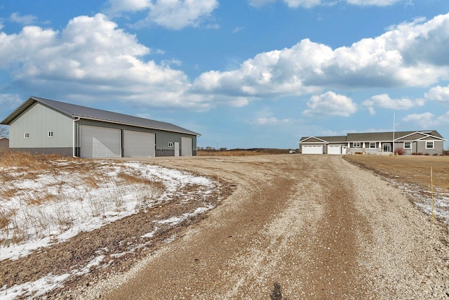 view of road featuring dirt driveway