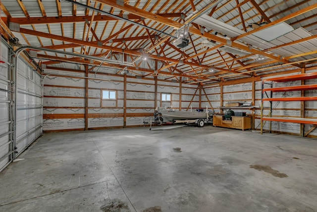 garage featuring a garage door opener and metal wall