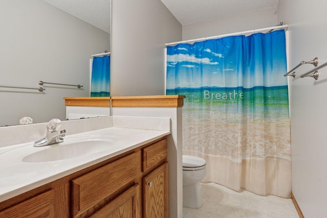 bathroom featuring toilet, a textured ceiling, vanity, and a shower with curtain