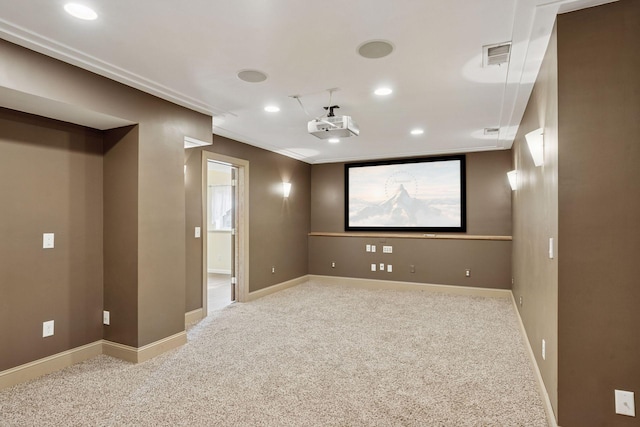 carpeted home theater room featuring visible vents, recessed lighting, and baseboards