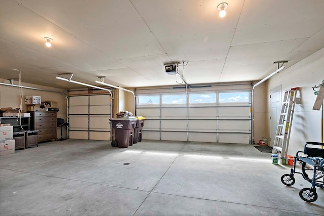 garage featuring a garage door opener