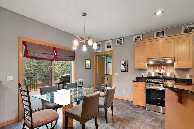 dining area with baseboards and stone finish flooring