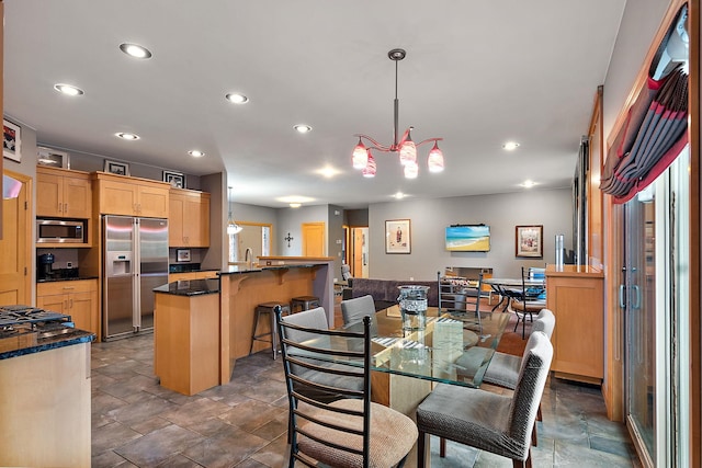 dining room featuring recessed lighting and stone finish floor