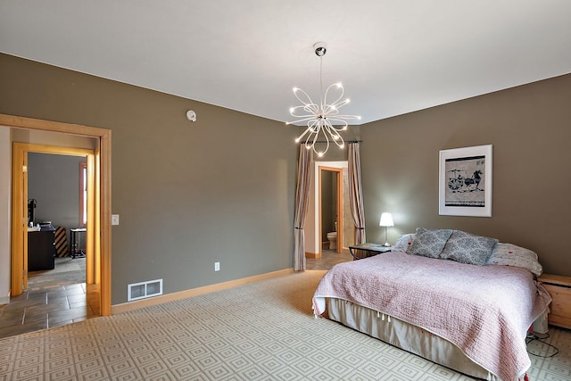 bedroom featuring visible vents, baseboards, and a notable chandelier