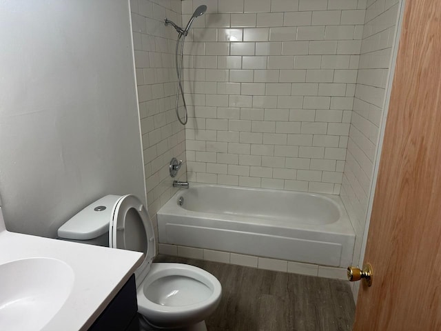 full bathroom with vanity, shower / bath combination, wood finished floors, and toilet