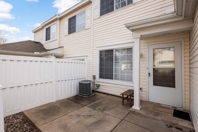 view of patio with fence and central AC