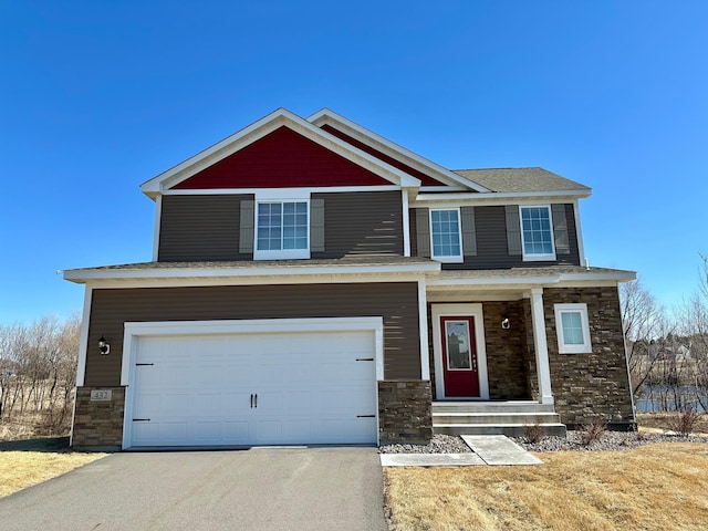 432 Wildflower Ct, Waverly, MN 55390 - craftsman-style home with stone siding, a garage, a porch, and driveway