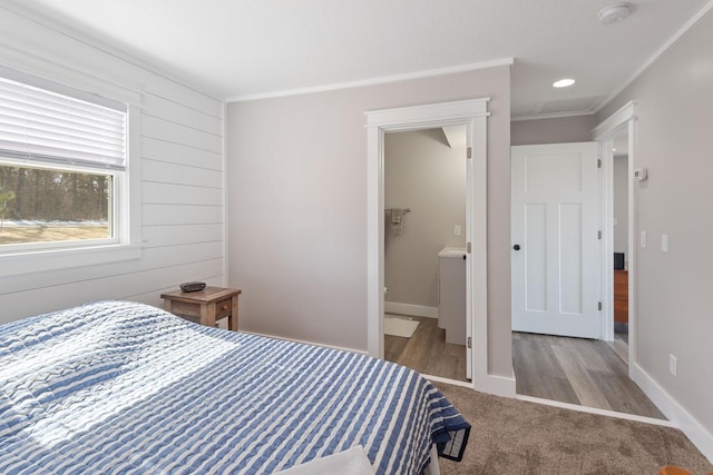 carpeted bedroom with baseboards and ornamental molding