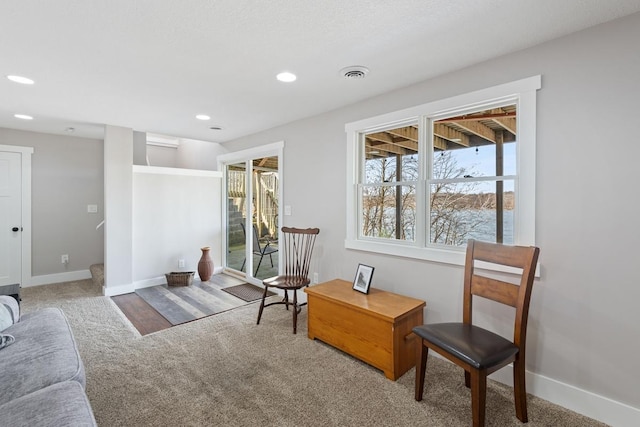 sitting room with recessed lighting, carpet flooring, visible vents, and baseboards