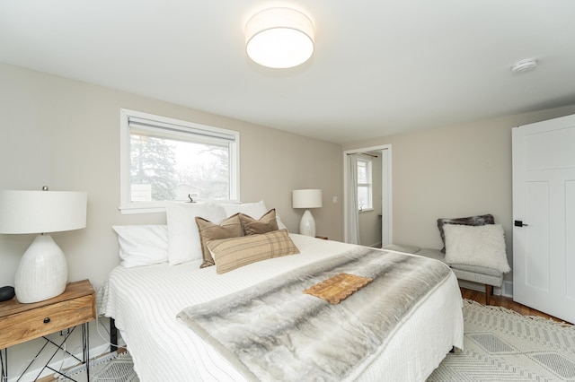 bedroom with light wood finished floors