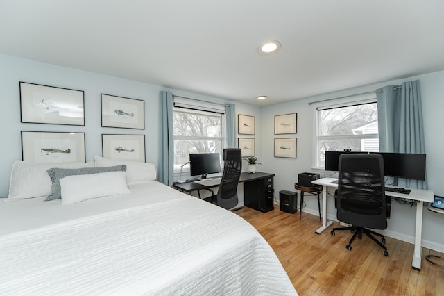 bedroom featuring recessed lighting, baseboards, and light wood-style floors