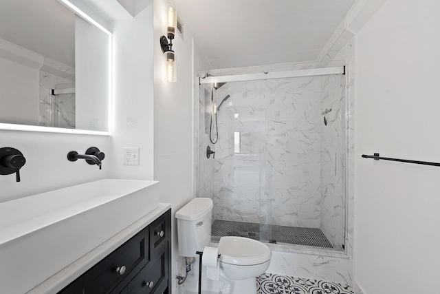 full bath with a marble finish shower, marble finish floor, toilet, and vanity