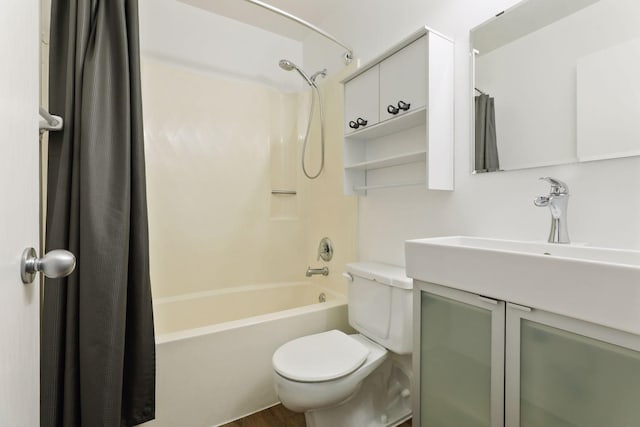 full bathroom with shower / tub combo, vanity, and toilet