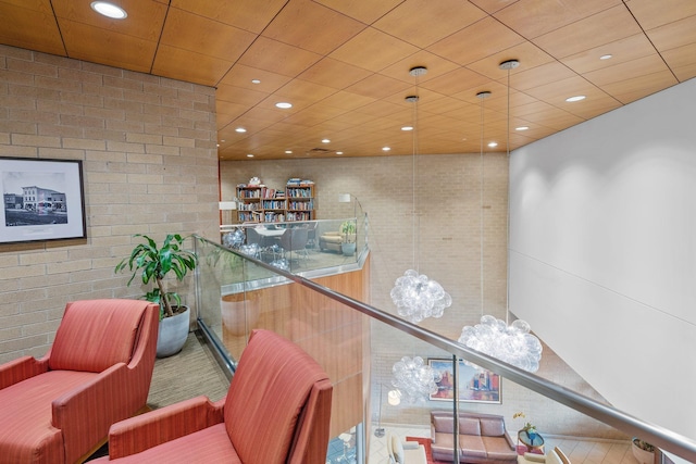 interior space featuring brick wall and recessed lighting