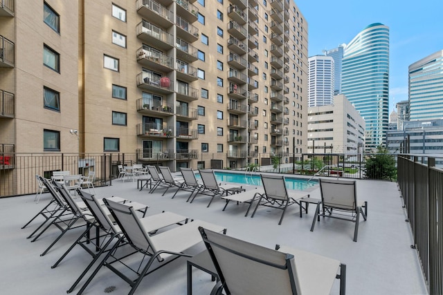 exterior space featuring fence and a city view