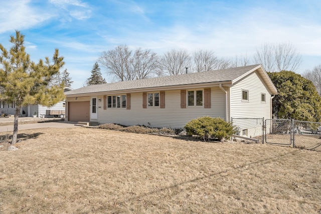 ranch-style house with a gate, fence, driveway, a front lawn, and a garage