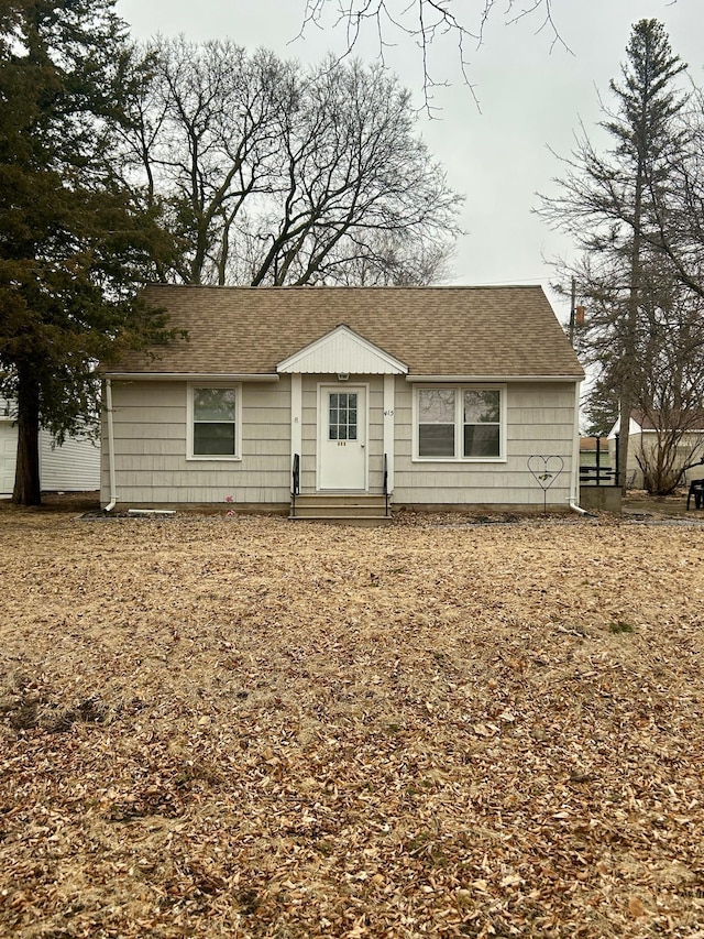 view of front of house featuring entry steps and roof with shingles