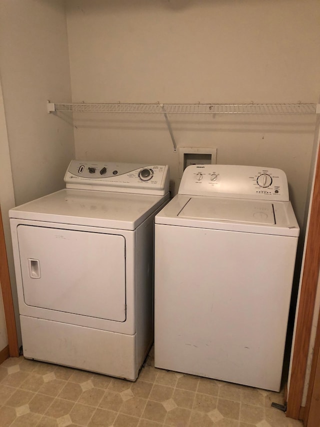 clothes washing area with laundry area and independent washer and dryer