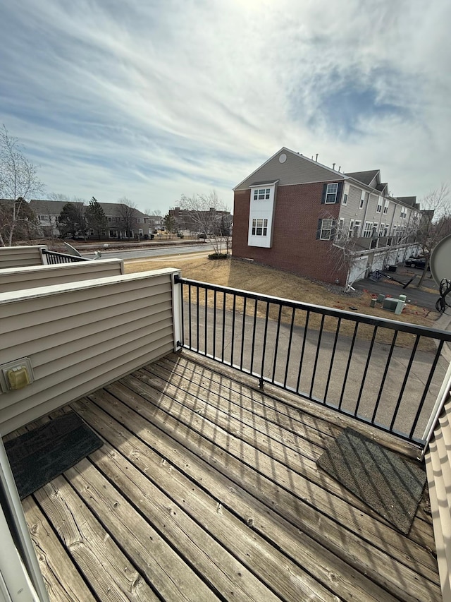 wooden terrace with a residential view