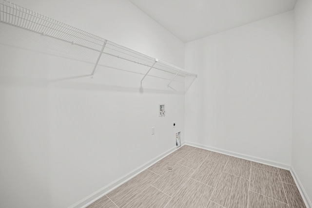 washroom featuring laundry area, washer hookup, electric dryer hookup, and baseboards