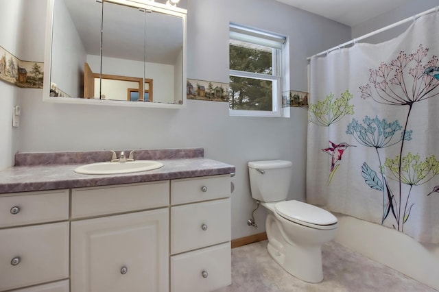 bathroom with tile patterned flooring, vanity, and toilet