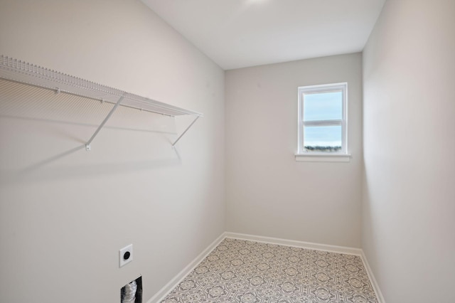 washroom featuring laundry area, baseboards, and electric dryer hookup