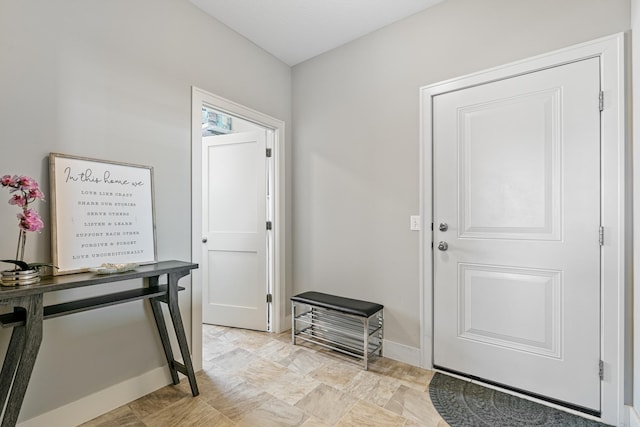 foyer entrance with baseboards