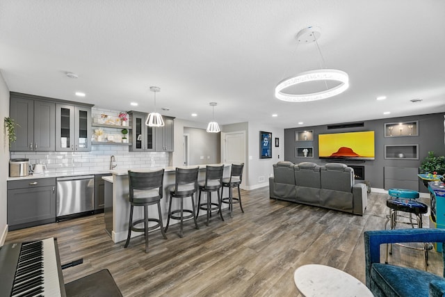 interior space with wet bar, dark wood finished floors, baseboards, and recessed lighting